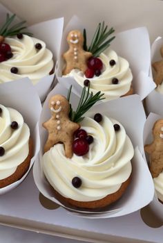 some cupcakes with icing and decorations on them