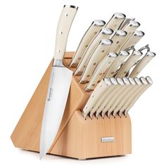 a knife block with many knives in it