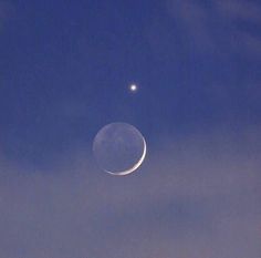 the moon and venus are visible in the sky