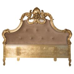 an ornate gold headboard on a white background