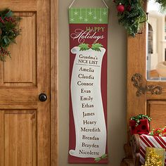 a christmas banner hanging on the wall next to a door