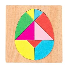 a wooden puzzle with different colored shapes