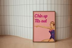 a pink poster with the words chubby up this out in front of a tiled wall