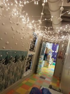 a hallway decorated with christmas lights and decorations