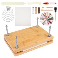 a bamboo cutting board with tools on it