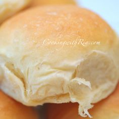 three rolls with cream on them sitting next to each other in front of the camera