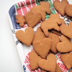 some heart shaped cookies are on a tray