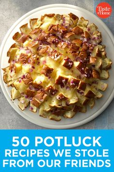 a white plate topped with potatoes on top of a table