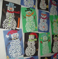 a group of snowmen made out of paper on a white wall with black and green squares