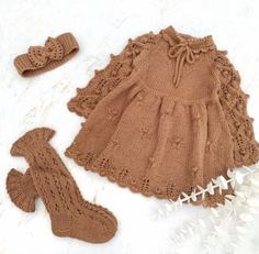 a brown knitted dress and booties on a white surface