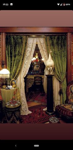 an ornately decorated living room with green drapes