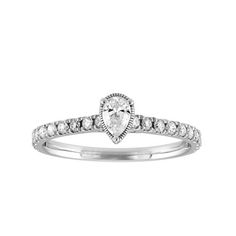 Make a proposal special and memorable with this diamond pear shape solitaire style ring created in 10K White Gold. Crafted in a shiny finish, this ring contains a pear shape diamond in the center and is complimented enhanced with small round diamonds cascading down both sides. This diamond ring contains a total of 21 diamonds and has a total carat weight of 1/2 cttw. The diamonds are securely set in a prong setting. Perfect for engagements. Ladies diamond rings. Engagement rings. Solitaire rings Gold G, Pear Engagement Ring, Ladies Diamond Rings, Pear Shaped Diamond, Solitaire Ring, Prong Setting, Diamond Rings, Round Diamonds, Womens Watches