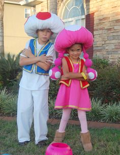 two children dressed in costumes standing next to each other