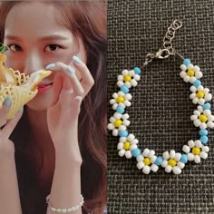 a woman is eating a piece of food next to a bracelet that has flowers on it