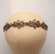 Copper Beaded Headband with Brass Flowers, Headbands for Women, Boho Hair Accessory for Adults or Teens, Gifts for Her I added some beaded copper appliqués and small brass flowers to this metal headband with is covered in black. the appliqués are covered in sequins and small beads, and I also added a small gold bead to the center of each flower. This Boho stye hair accessory would be so great for everyday wear, but would also be fun for a formal event. At the widest point the piece is close to 1.5 inches  Copper headband, Beaded Headband,  Brass Flowers, Headbands for Women, Boho Hair Accessory, Adults or Teens, Gifts for Her, boho headband, prom headband, Prom Headband, Brass Flowers, Beaded Headpiece, Metal Headband, Hair Accessories Boho, Boho Hair, Metal Headbands, Tie Headband, Beaded Headband