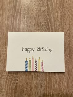 a happy birthday card with candles on it