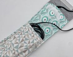 "This cute little cover is great for both home and travel. No need to wait until it cools down to pack up in the morning and you can keep it away from little hands that may accidentally burn.  Just tuck your iron in the case and then put the cord in its own little pocket and you are done. These also make great gifts, especially for bridesmaids! Each cover is fully lined with a protective heat-resistant material. The lining is made from a silver, heat resistant material. Each cover also closes wi Flat Iron Holder Diy, Iron Cover Pattern, Travel Flat Iron, Flat Iron Holder, Curling Iron Holder, Travel Flats, Ironing Boards, Flat Irons, Iron Holder