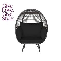 an egg chair with black cushions and the words give love, give style on it