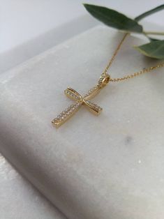 "A fine art cross in K14 made of yellow solid gold. It's decorate with lines of gold that create a very delicate cross in the middle and has small Swarovski stones throughout! A simple, minimal, inter temporal cross. Ideal for a present, engagement gift, anniversary and baptism. It is one of the most beautiful designs and can easily be worn by an adolescent or a woman of any age, who likes minimal design. The dimensions of the cross are: Height 1,26 inches (3,2 cm.) Width 0,67 inches (1,7 cm.) T Christian Thali Designs Gold, Locket Design, Cross Necklace Women, Cross Gold, Cross Christian, Gold Cross Pendant, Swarovski Stones, Gold Locket, Christian Cross