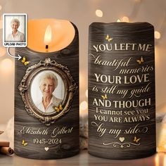 a candle with an image on it next to a photo and some candles in the background