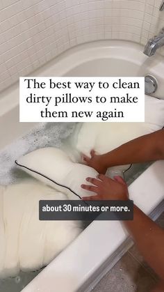 a person is washing their hands in a bathtub with the words, the best way to clean dirty pillows to make them new again about 30 minutes or more