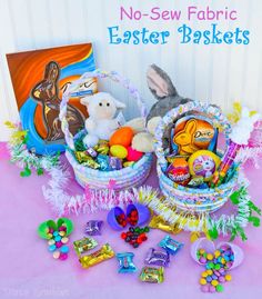 an easter basket filled with candy, candies and stuffed animals sits on a table