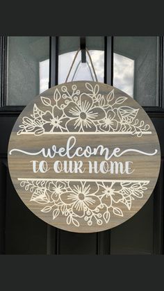 a sign that says welcome to our home hanging on the front door with an open window