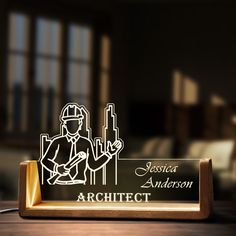 Elevate the art of personalization with our Personalized LED Light Desk Nameplate, a unique and thoughtful gift that shines in every sense. This meticulously crafted desk accessory not only adds a touch of sophistication to any workspace but also serves as a heartfelt gesture when given as a personalized gift Crafted from high-quality materials, the Custom Lighted Desk Sign combines durability with a sleek, modern design. The premium finish ensures it seamlessly integrates into any office or hom Led Light Desk, Architect Desk, Architects Desk, Office Desk Name Plates, Desk Plaques, Light Desk, Wood Name Sign, Desk Name Plate, Wood Names