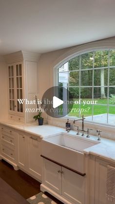 a large kitchen with white cabinets and an oval window that says what is the most important prop?