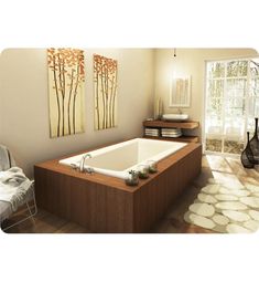 a bathroom with a large jacuzzi tub next to a white rug and two paintings on the wall