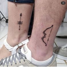 two people with matching tattoos on their legs, one has an arrow and the other has a bow