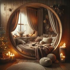 a circular bed in a room with candles around it