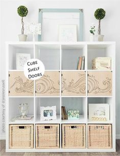 a white bookcase with baskets and pictures on it that says spell your own word