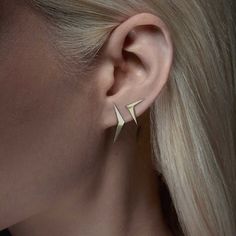 Add some edgy style to your look with our angled wing earrings! These mismatched stud earrings are crafted in solid 14k gold with a high polish finish. Wear them together in either ear or split them across your lobes or helix for an edgy touch. Type: Pair of gold stud earrings Post: Traditional post with 14k push back Dimensions: straight wing is width 3.5mm x height 24mm, angled wing width 13mm x height 16mm Metal: 14 karat solid yellow gold (recycled, nickel-free and hypoallergenic) To ensure Kite Earrings, Antler Earrings, Gold Ear Climbers, Double Piercing, Chevron Earrings, Branch Earrings, Spike Earrings, Mismatched Earrings, Wing Earrings