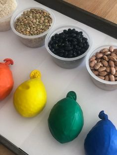 there are many different foods in bowls on the table