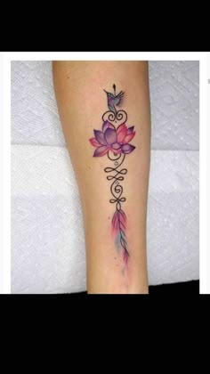 a woman's leg with a tattoo on it and a bird flying over the flower