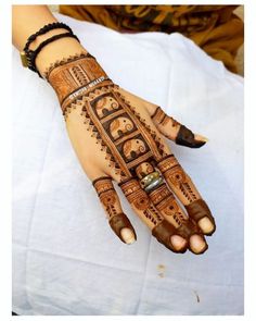 henna tattoo on the palm of a woman's hand