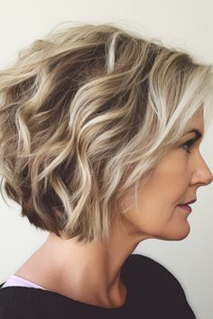 The curled-under bob is a classic, elegant choice. Curling the ends under frames your face beautifully and adds a sense of finesse. Click here to check out more flattering hairstyles for women over 50 with thick hair. Wavy Bob Haircuts, Thick Wavy Hair, Bob Hairstyles For Thick, Wavy Bob Hairstyles, Wavy Haircuts, Chin Length Hair, Short Hairstyles For Thick Hair, Haircuts For Medium Hair, Bob Haircuts For Women