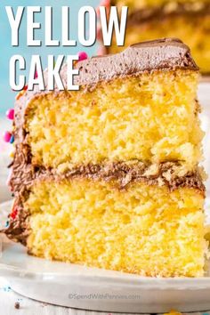 a yellow cake with chocolate frosting and sprinkles is on a plate