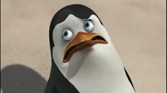 a cartoon penguin with an angry look on its face