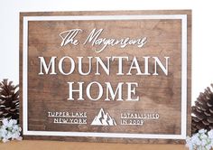 a wooden sign that says the mountains mountain home