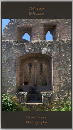 an old stone building with windows and steps