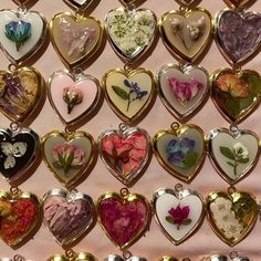 many heart shaped flowers are on display in the shape of lockes with different colors and shapes