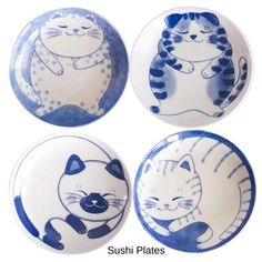 three blue and white plates with cats on them