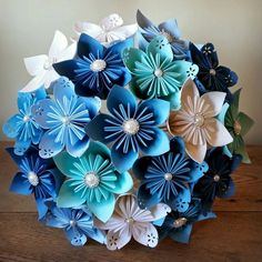 a bouquet of blue and white paper flowers