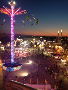 an aerial view of a carnival at night