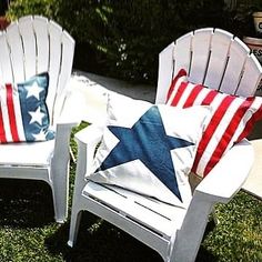 two lawn chairs with patriotic pillows on them