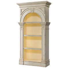 a tall white shelf with yellow shelves on it's sides and an arched doorway at the top