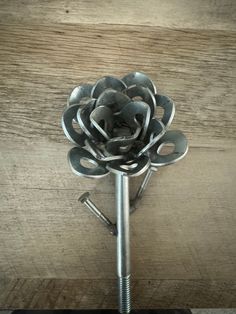 there is a metal flower made out of screws