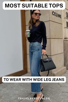 What tops look the best with wide leg jeans during the fall and winter months? Find out here! Business Casual Wide Leg Jeans, Wide Leg Trousers Shoes Winter, Wide Leg Jeans Ankle Boots, Wide Leg Jeans Outfit Classy, Wide Leg Jeans Outfit Winter 2025, Sweaters With Wide Leg Jeans, Wide Leg Jeans Outfit Night Out, Wide Leg Jeans Business Casual, Chequered Shirt Outfit Women